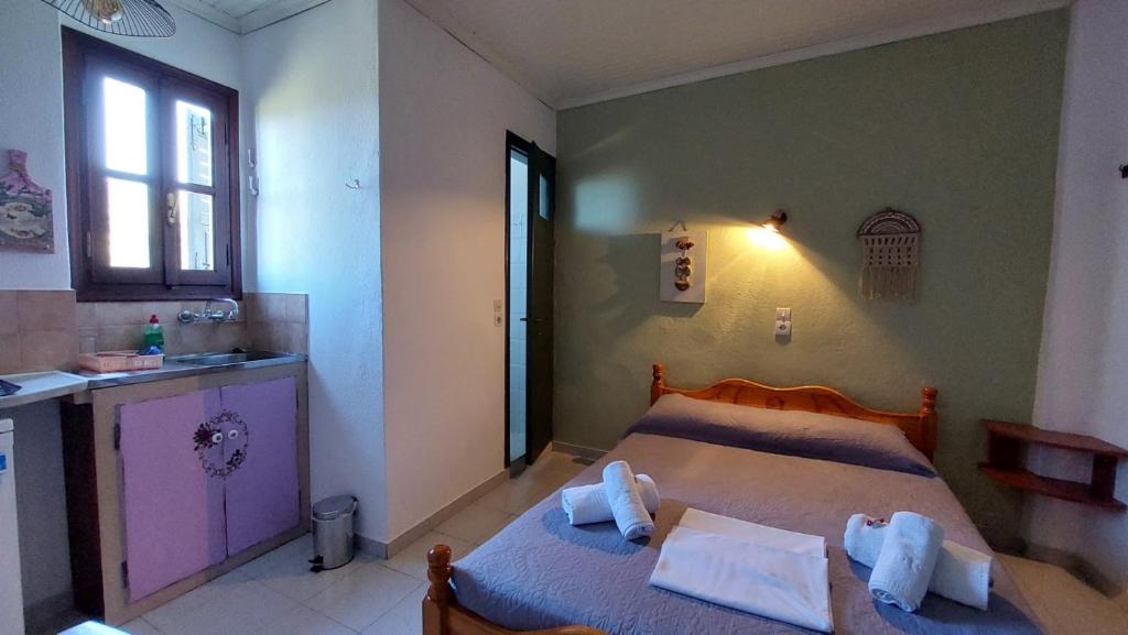 Postel nebo postele na pokoji v ubytování SunRiseStudiosPapanero