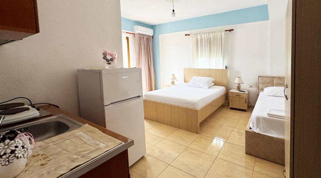 Postel nebo postele na pokoji v ubytování Antonia Rooms Qeparo