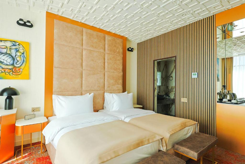 Postel nebo postele na pokoji v ubytování Carat Hotel Yerevan