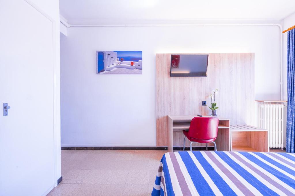 TV a/nebo společenská místnost v ubytování Hotel Bell Aire