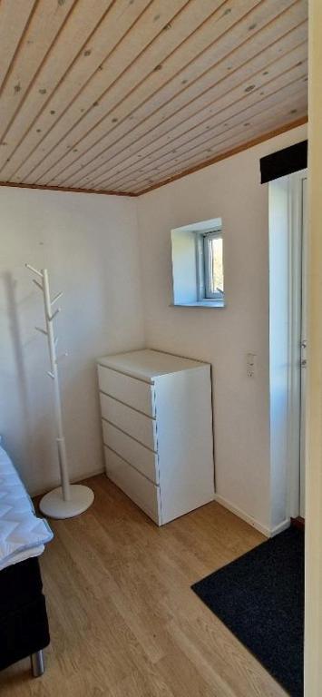Postel nebo postele na pokoji v ubytování Grandgården