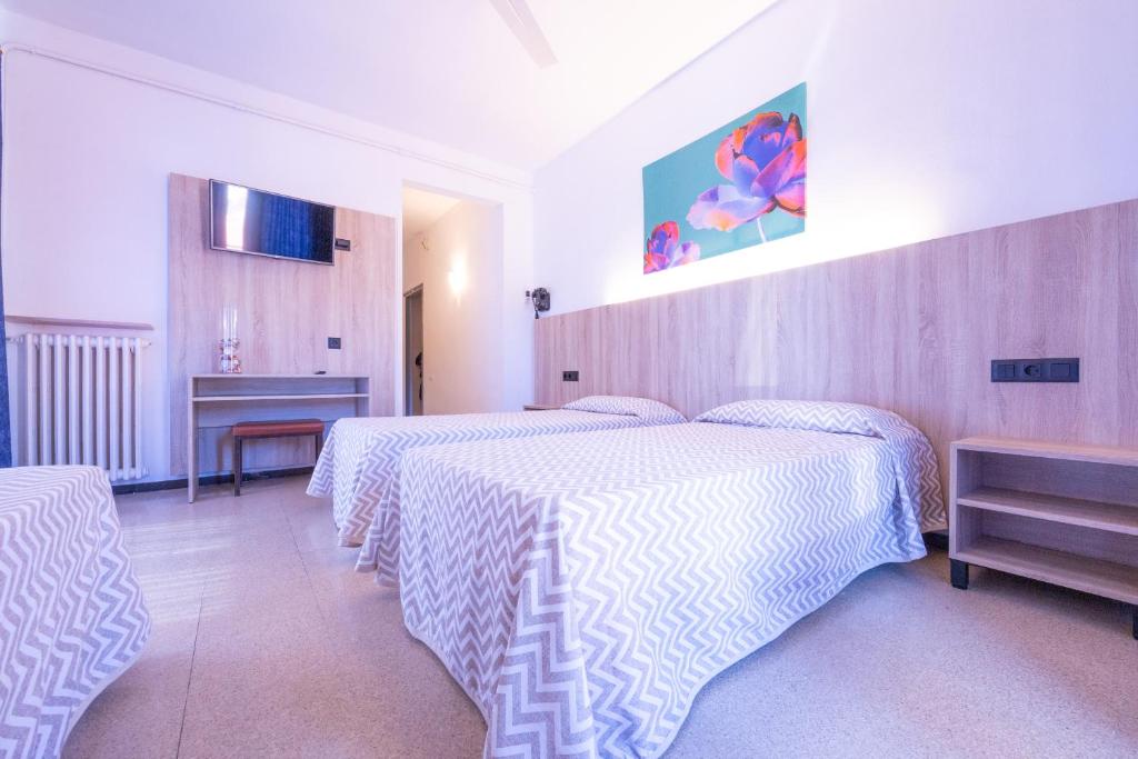 Postel nebo postele na pokoji v ubytování Hotel Bell Aire