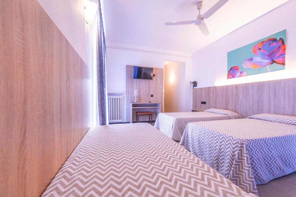 Postel nebo postele na pokoji v ubytování Hotel Bell Aire