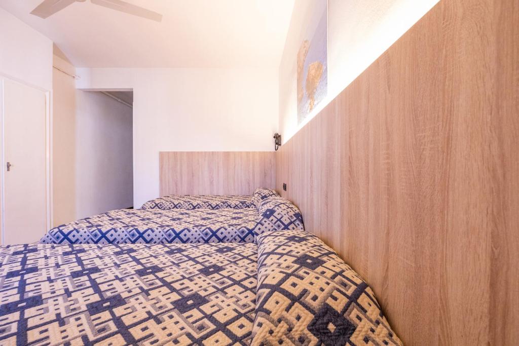 Postel nebo postele na pokoji v ubytování Hotel Bell Aire