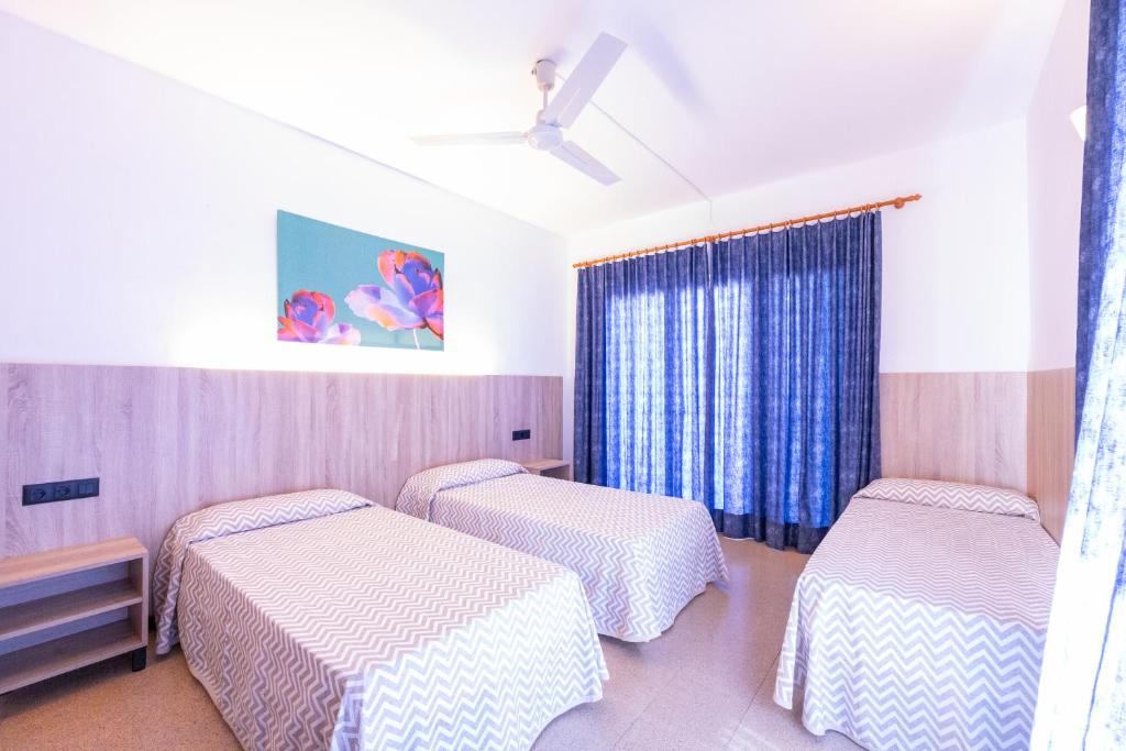 Postel nebo postele na pokoji v ubytování Hotel Bell Aire