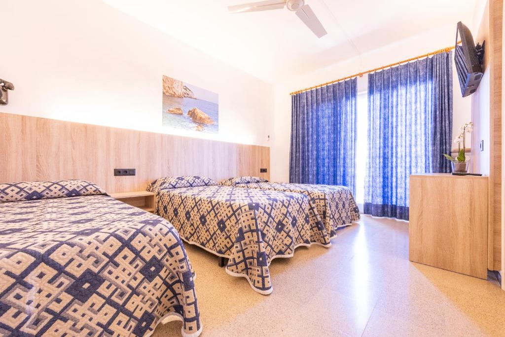 Postel nebo postele na pokoji v ubytování Hotel Bell Aire