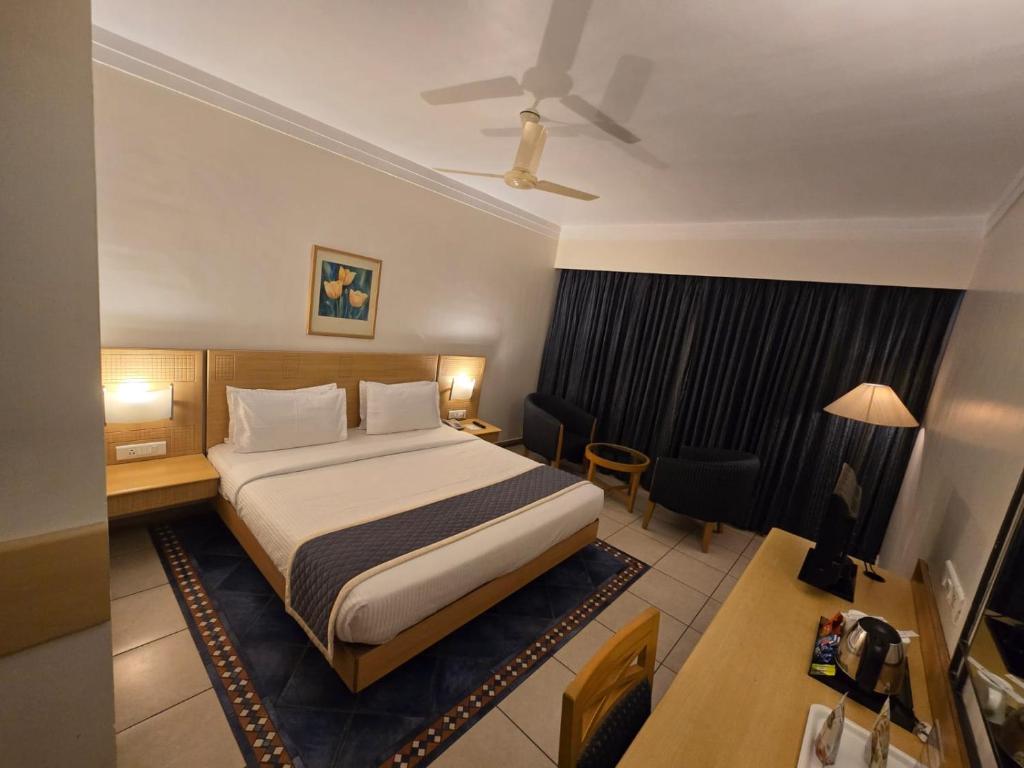 Postel nebo postele na pokoji v ubytování Harrisons Hotel