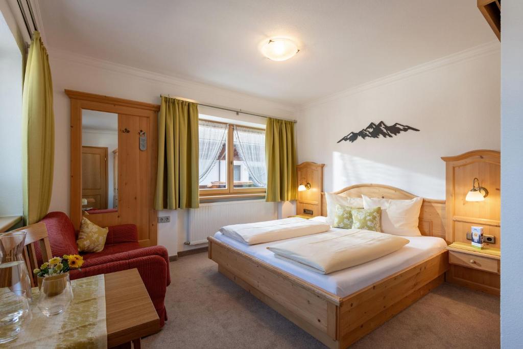Postel nebo postele na pokoji v ubytování Hotel Eggerwirt