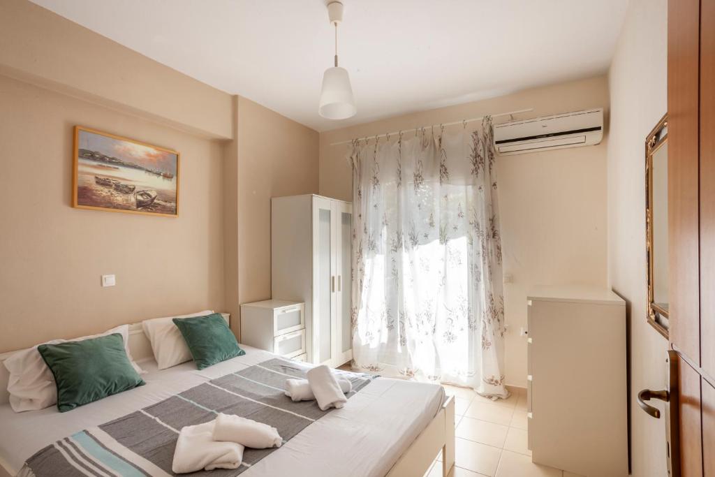 En eller flere senge i et værelse på Alex apartment