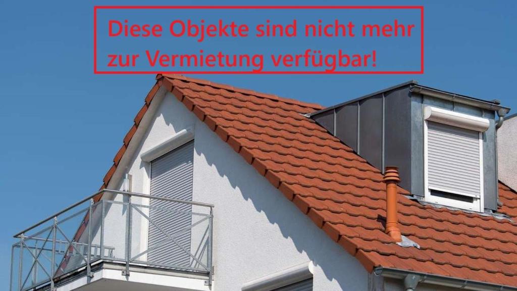 a roof of a building with a balcony on it at Modern stylish apartment 10 min near Messe in Schwalbach am Taunus