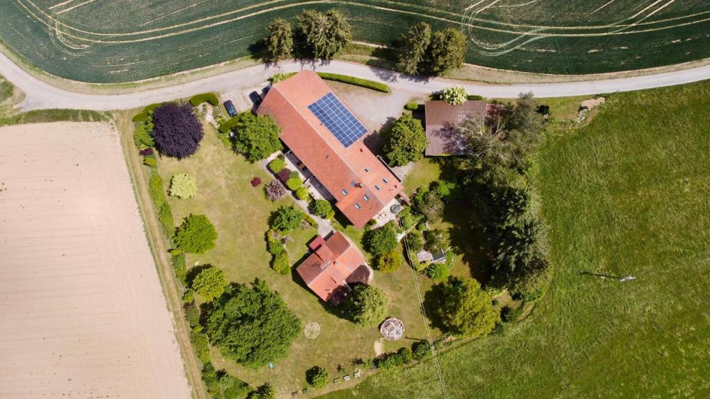 an overhead view of a house with trees and a road at Hinterhaus in Herdwangen