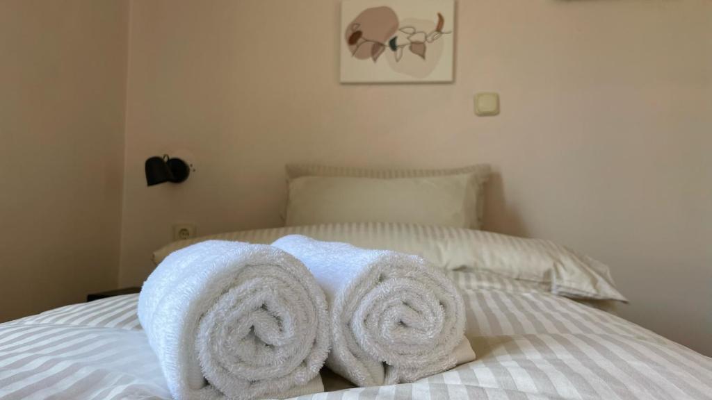 Postel nebo postele na pokoji v ubytování Hotel Michel