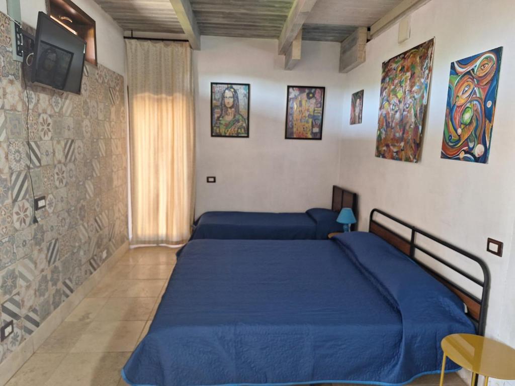 Postel nebo postele na pokoji v ubytování Casa Mattia - B&B in Legno & Paglia