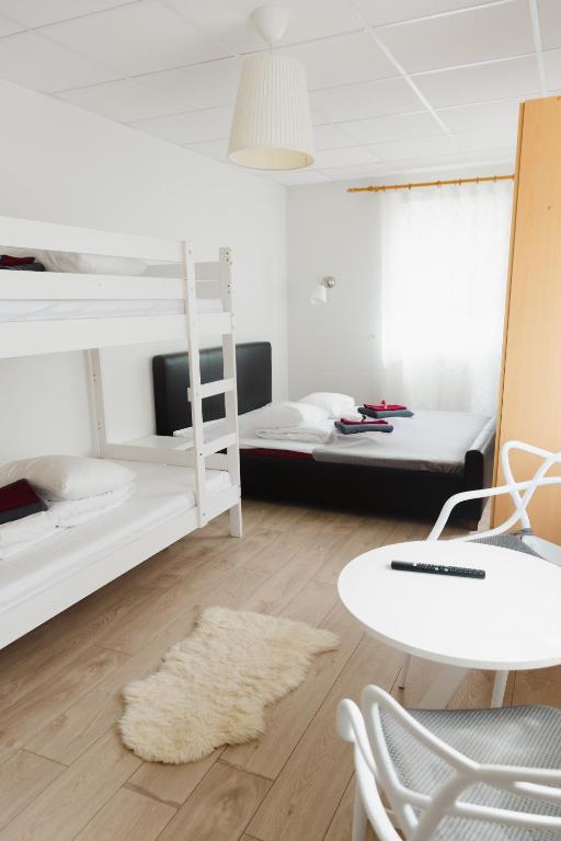 Postel nebo postele na pokoji v ubytování Konrad Family Guesthouse