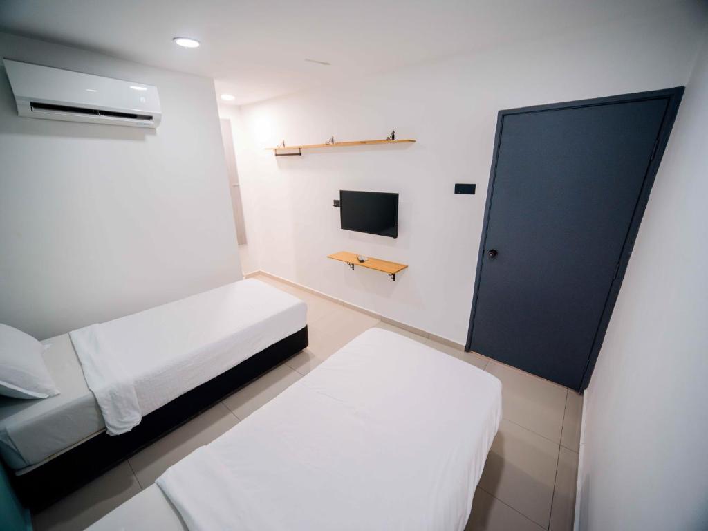 Postel nebo postele na pokoji v ubytování Orkid Inn Kajang