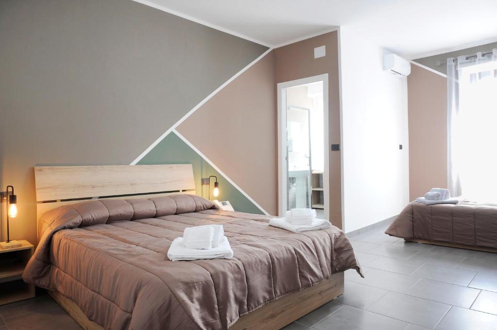 Postel nebo postele na pokoji v ubytování Hotel Riesco