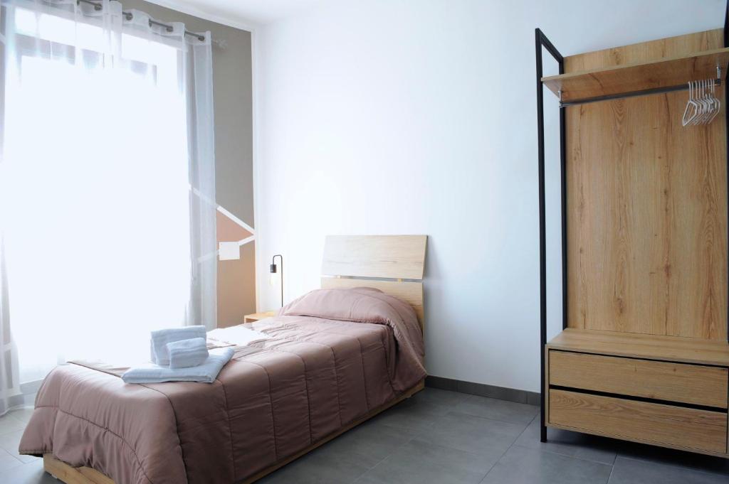 Postel nebo postele na pokoji v ubytování Hotel Riesco