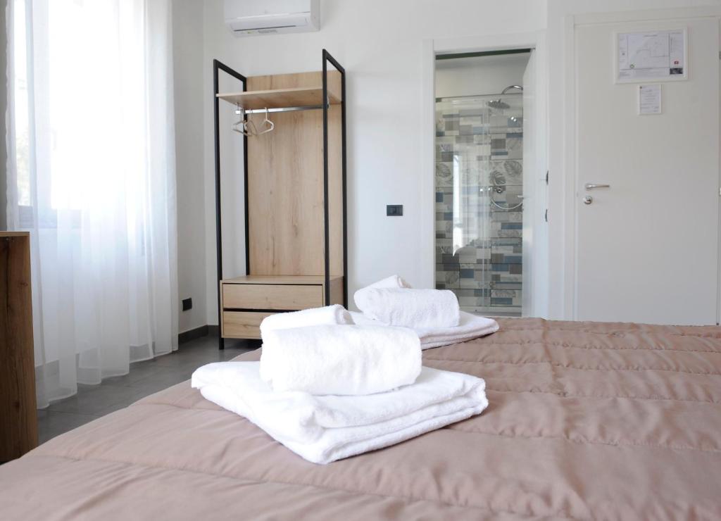 Postel nebo postele na pokoji v ubytování Hotel Riesco