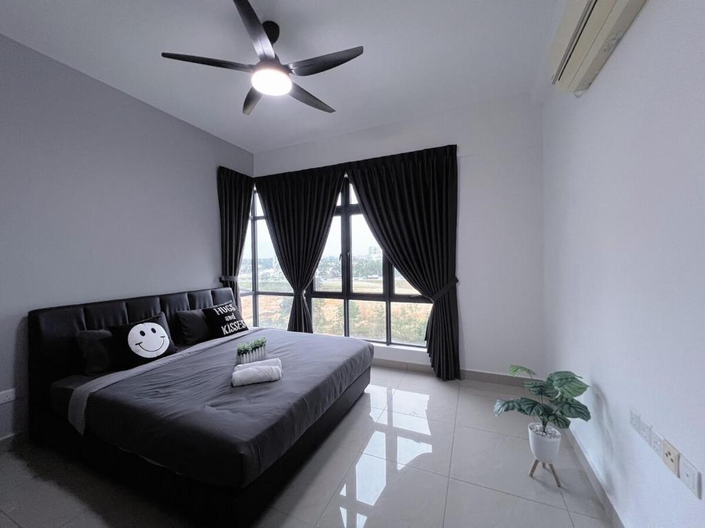 a bedroom with a couch and a ceiling fan at BIG Two Bedrooms 1-6 Pax Luxury Condo at D Secret Garden - Johor Bahru-Setia Tropika-UTM-Mid Valley-Paradigm Mall in Johor Bahru