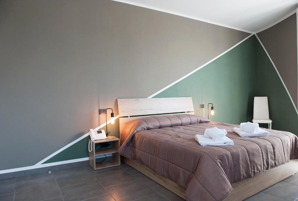 Postel nebo postele na pokoji v ubytování Hotel Riesco