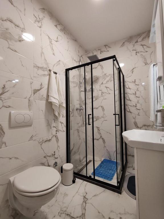 Koupelna v ubytování Rooms DM - Una