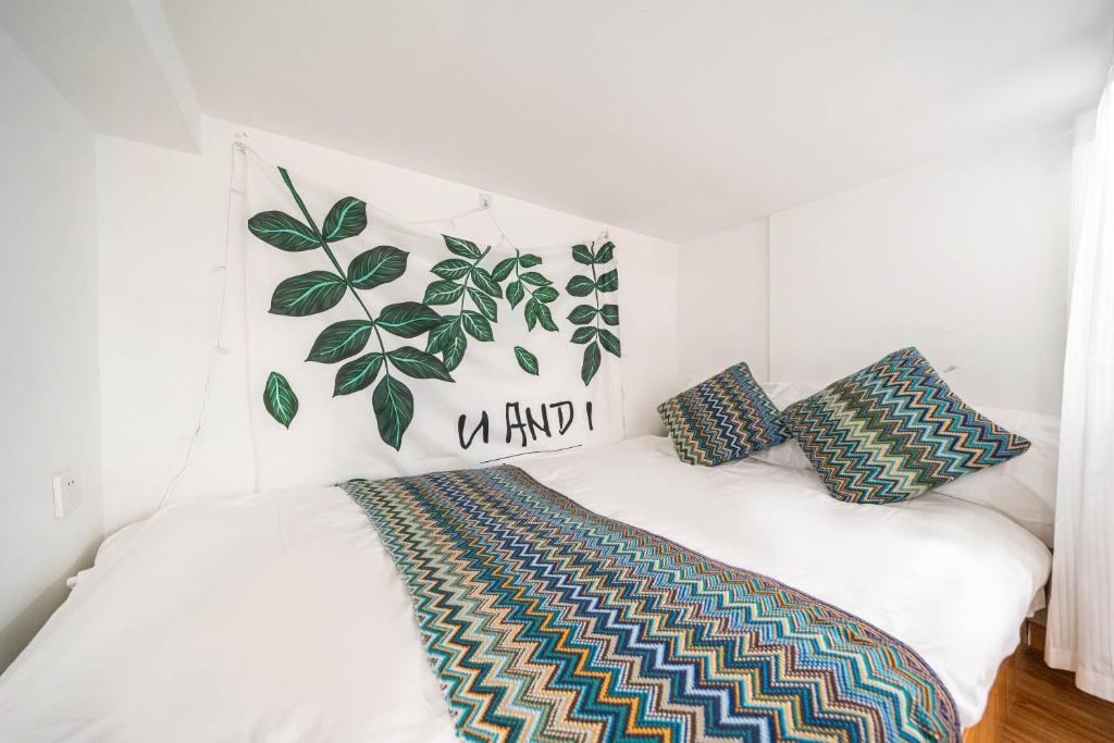 Postel nebo postele na pokoji v ubytování 柃居 B&B - IAPM Branch