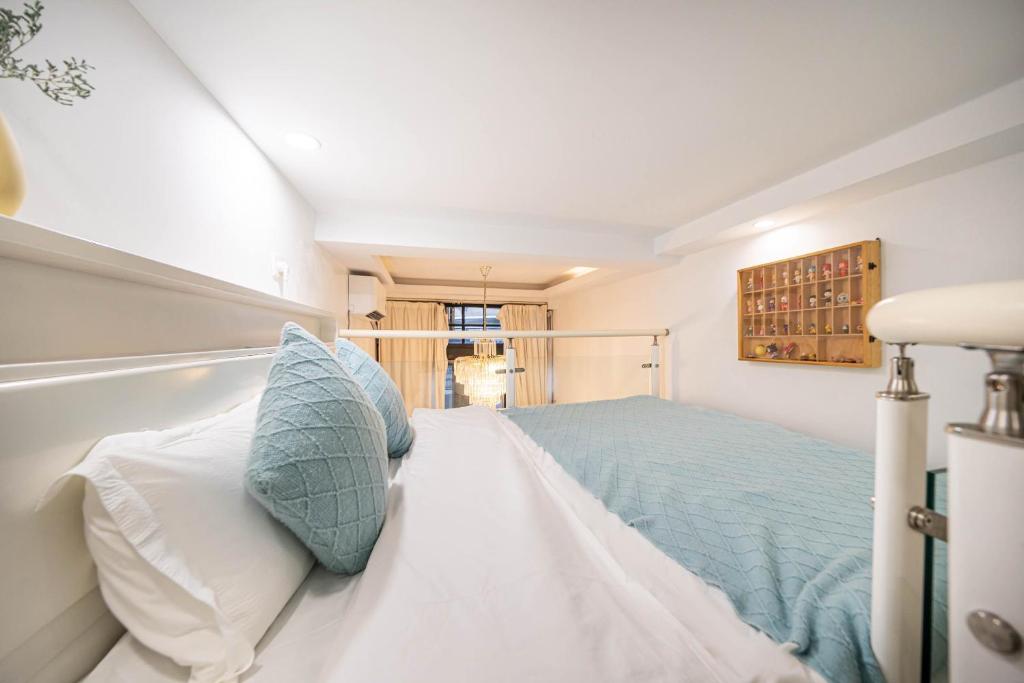 Postel nebo postele na pokoji v ubytování 柃居 B&B - IAPM Branch