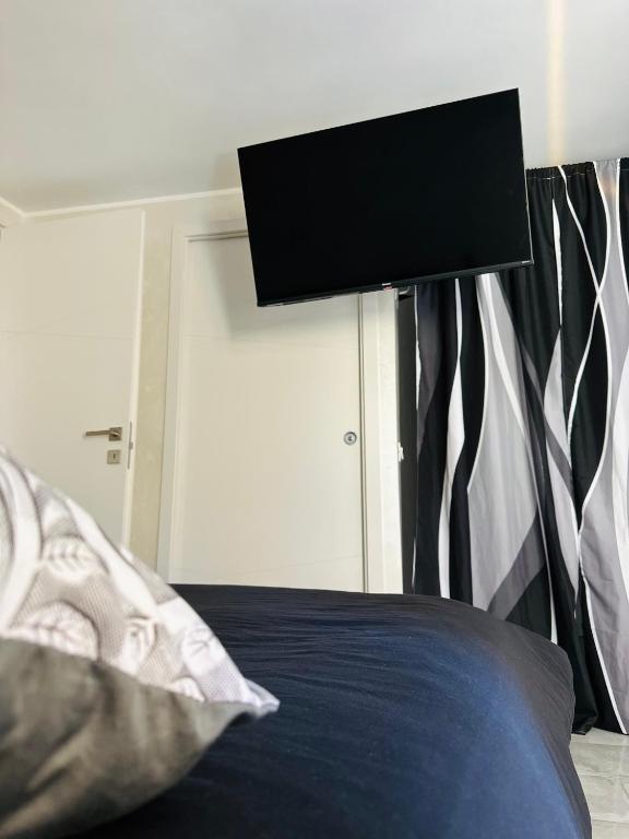TV a/nebo společenská místnost v ubytování Il Rifugio Nel Vicolo