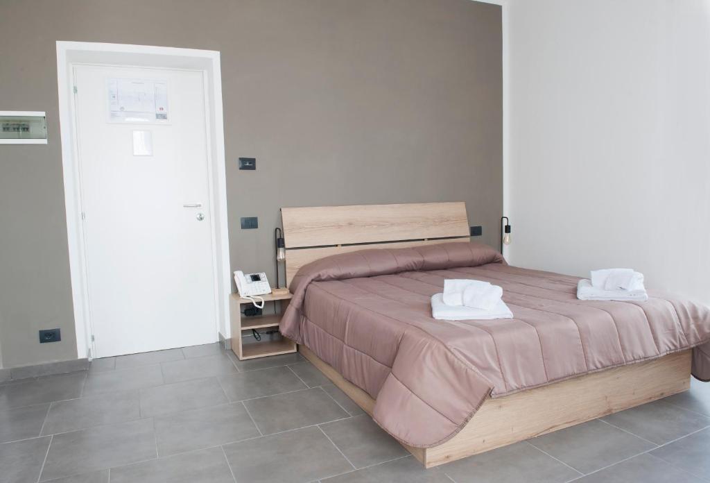 Postel nebo postele na pokoji v ubytování Hotel Riesco