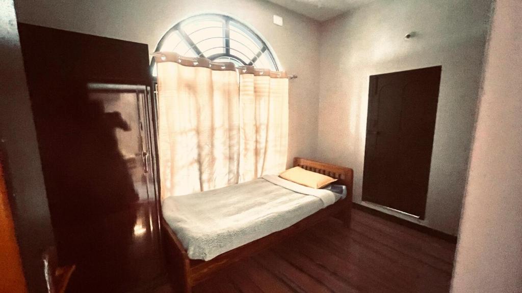 Postel nebo postele na pokoji v ubytování PENTHOUSE -Thanjavur home stays
