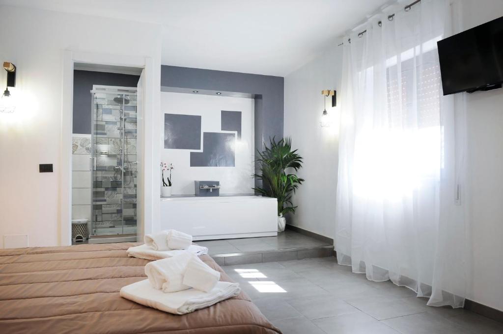 Postel nebo postele na pokoji v ubytování Hotel Riesco