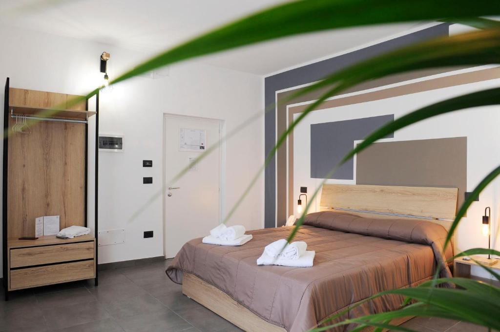 Postel nebo postele na pokoji v ubytování Hotel Riesco