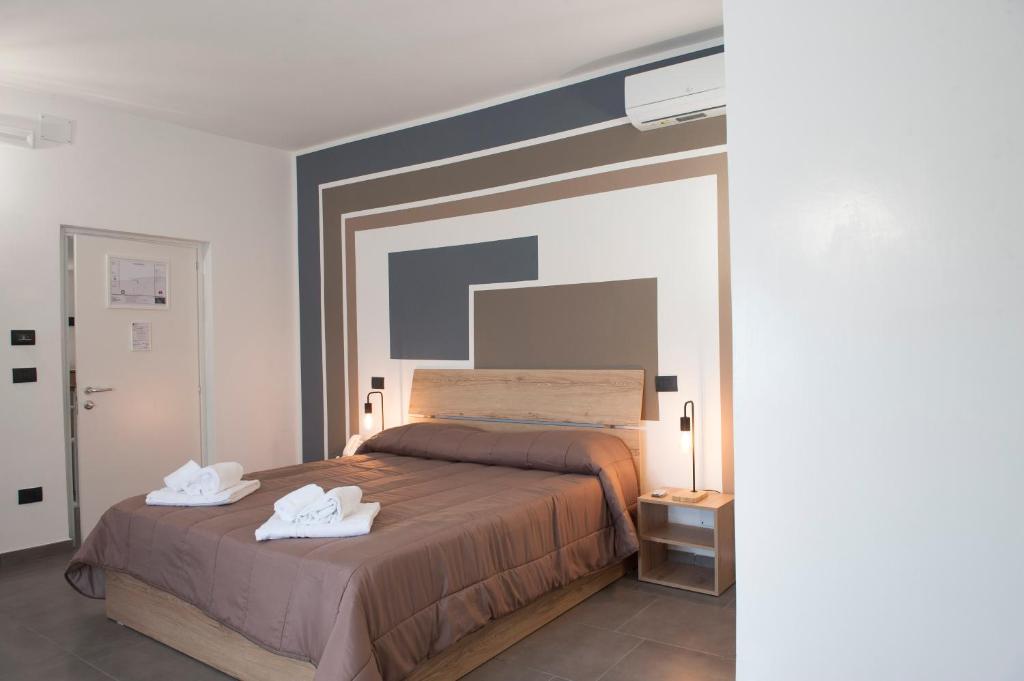 Postel nebo postele na pokoji v ubytování Hotel Riesco