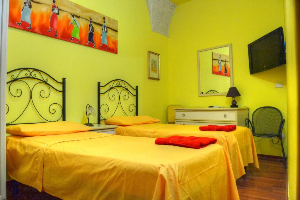 Postel nebo postele na pokoji v ubytování B&B La Corte Lecce