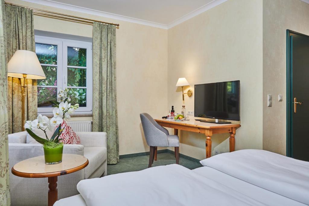 TV a/nebo společenská místnost v ubytování Hotel Freisinger Hof