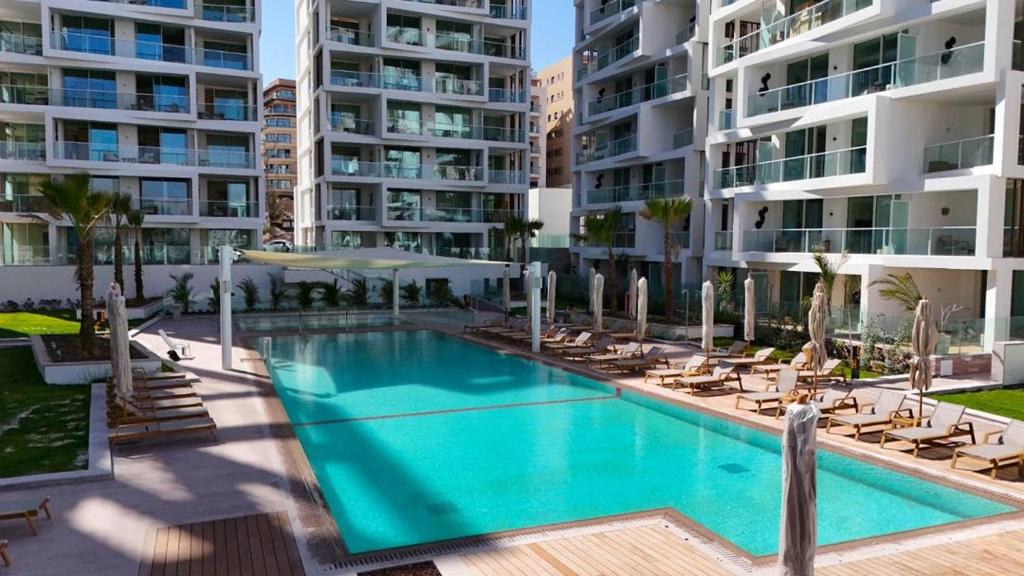 an image of a swimming pool at a apartment complex at Rivi Luxury 42 Suites - By SEAELO EILAT in Eilat