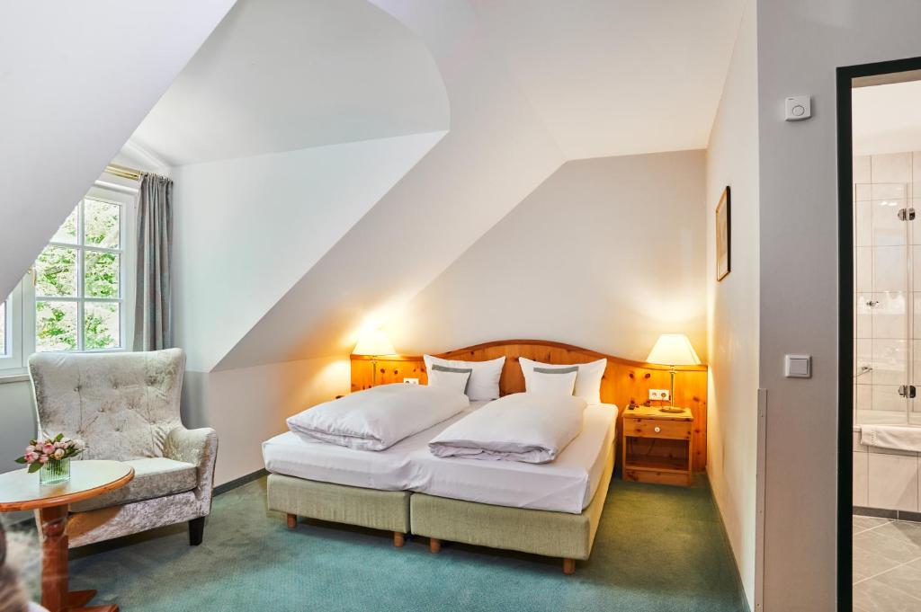 Postel nebo postele na pokoji v ubytování Hotel Freisinger Hof