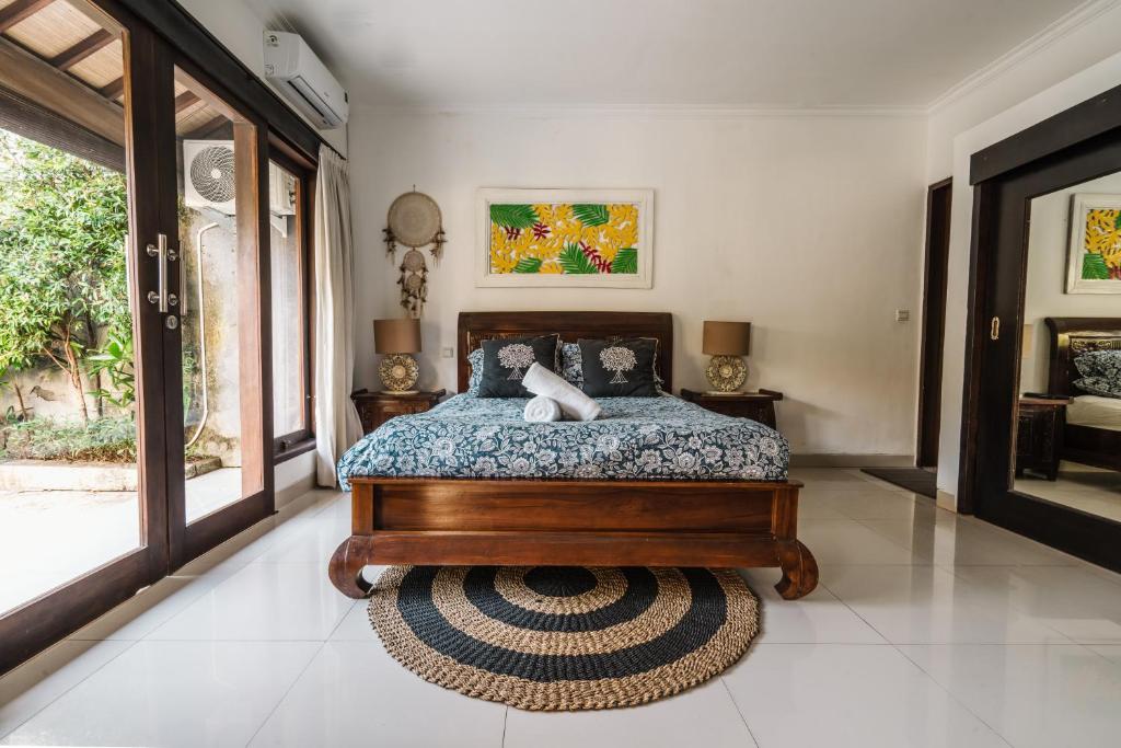 Uma cama ou camas num quarto em Sari Temuku Villa