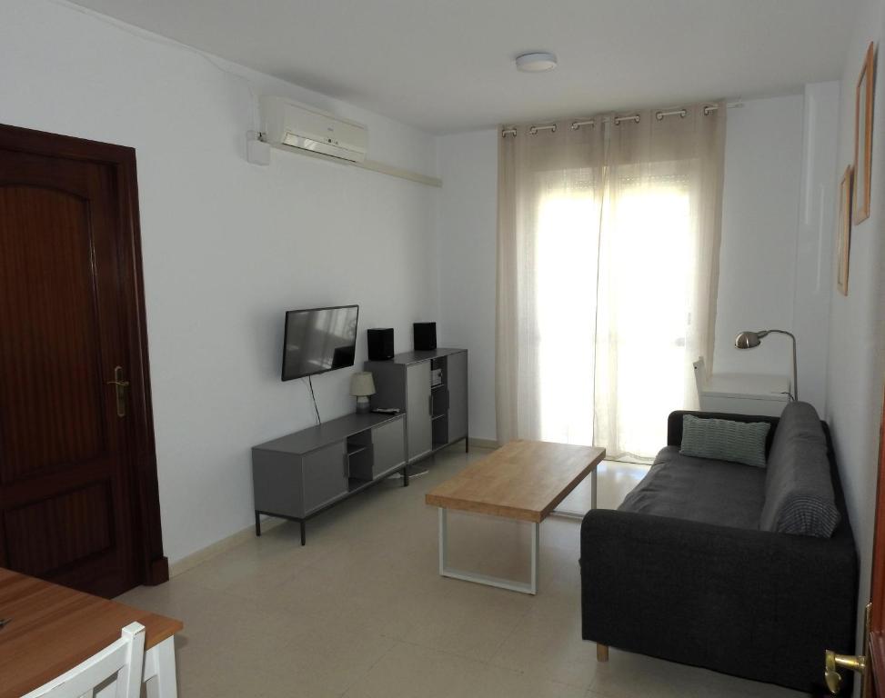 Televízia a/alebo spoločenská miestnosť v ubytovaní Glauka Apartamento tranquilo con Aire Acondicionado