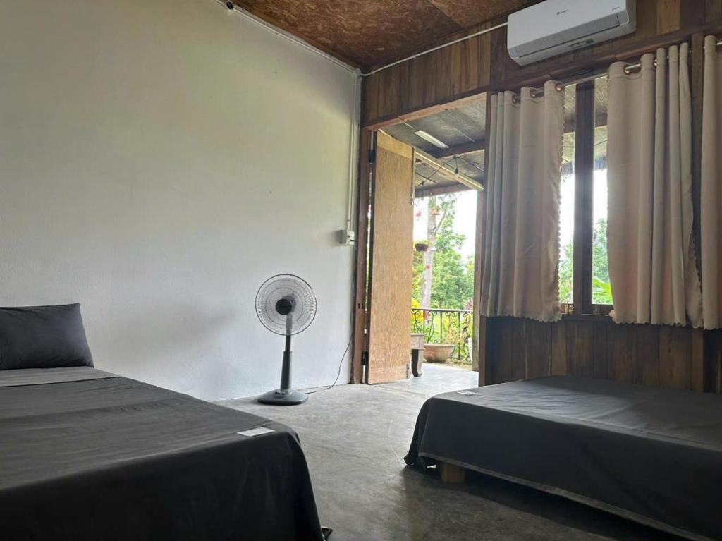 Postel nebo postele na pokoji v ubytování Homie Hava Homestay