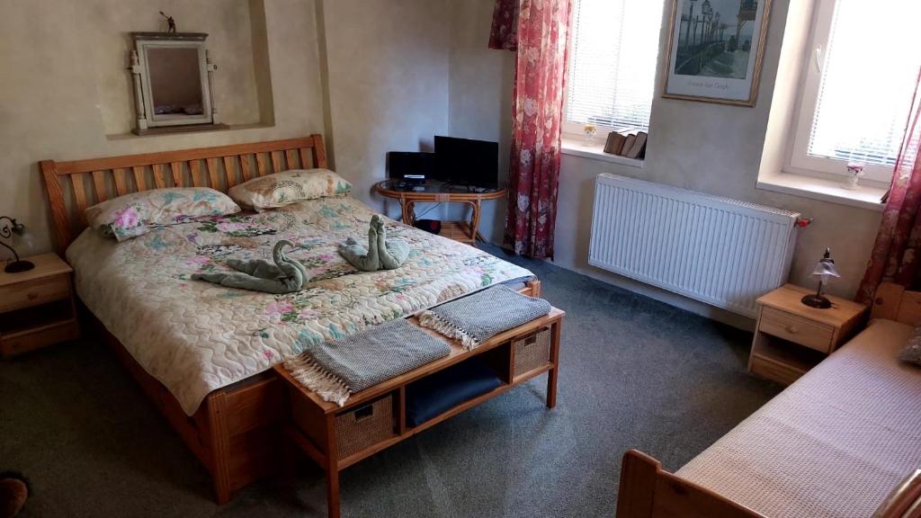Postel nebo postele na pokoji v ubytování Vila Kost