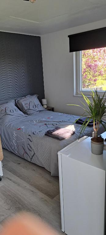 Postel nebo postele na pokoji v ubytování Au coin du hérisson