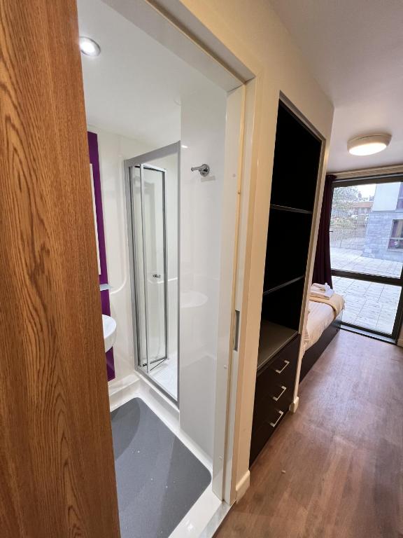 a bathroom with a walk in shower and a sink at Astor House by Pureserviced in Plymouth