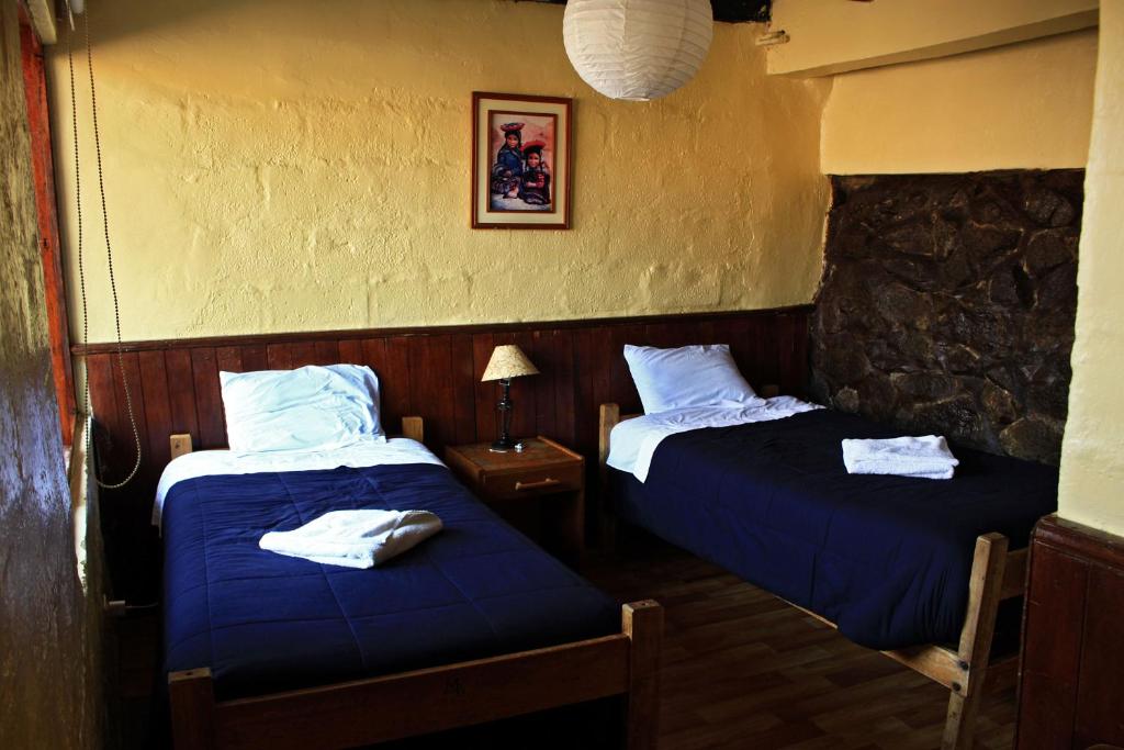 Voodi või voodid majutusasutuse Samay Wasi Hostel I toas