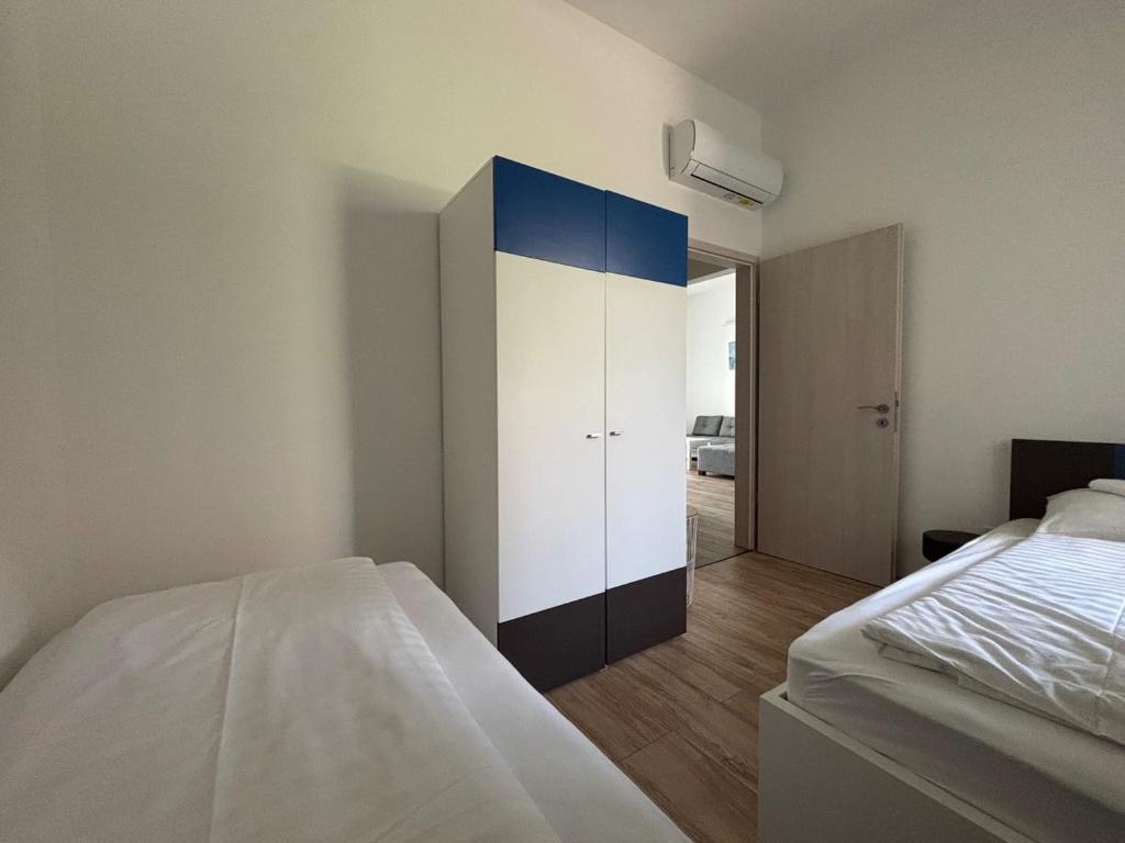 Posteľ alebo postele v izbe v ubytovaní Aranyhíd Deluxe Apartman