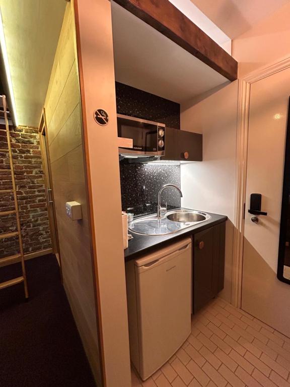 Kuchyň nebo kuchyňský kout v ubytování Hotel 22