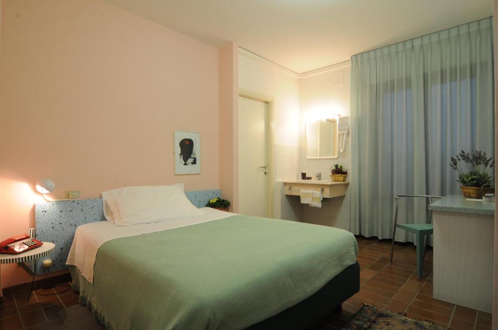 Postel nebo postele na pokoji v ubytování Hotel Alexandra