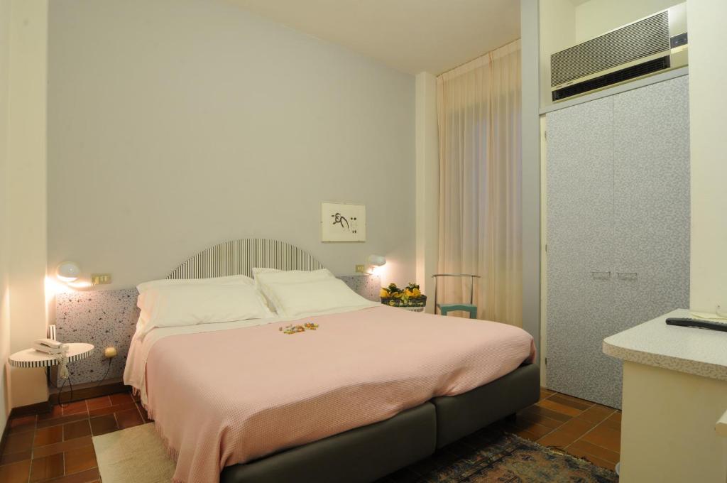 Postel nebo postele na pokoji v ubytování Hotel Alexandra