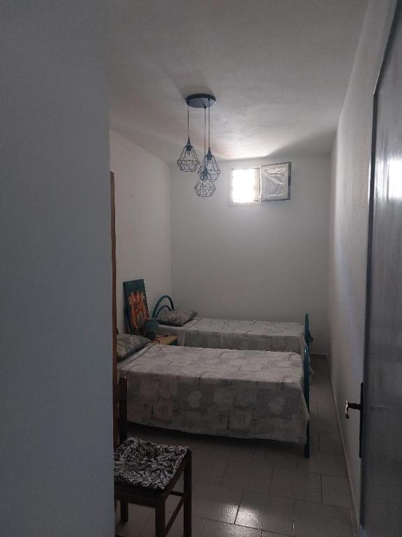 Postel nebo postele na pokoji v ubytování Casa Samuel