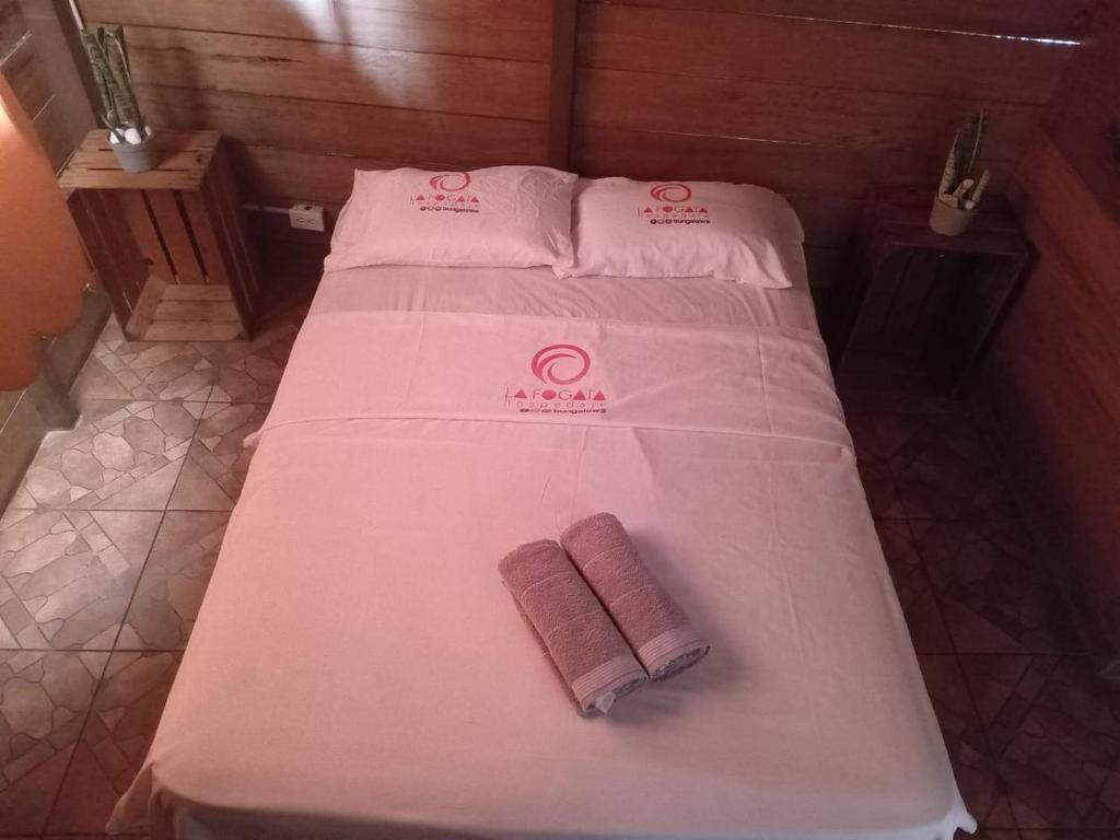 Postel nebo postele na pokoji v ubytování La Fogata